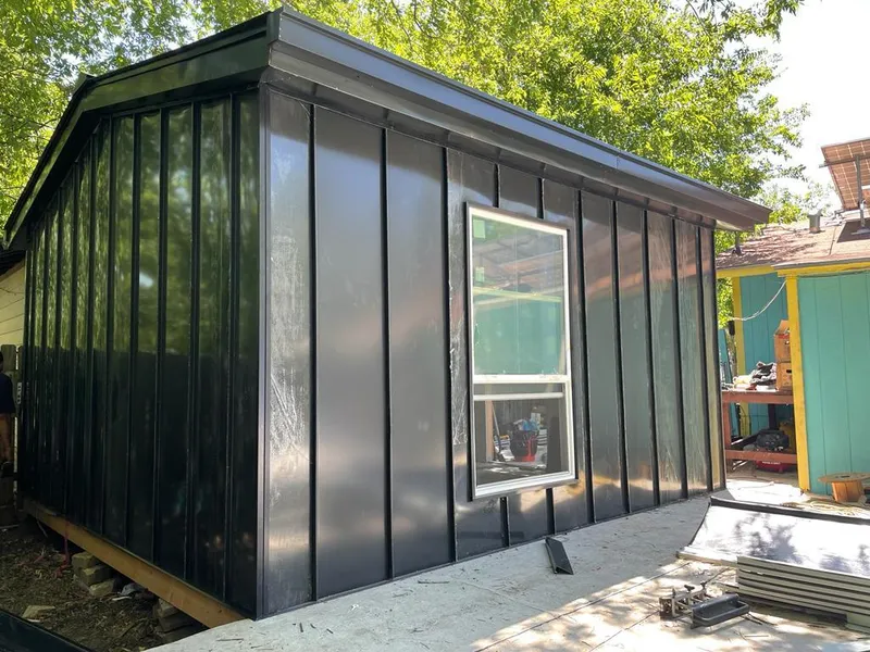 Black standing seam metal wall panels for Roof Inspection in Oak Grove